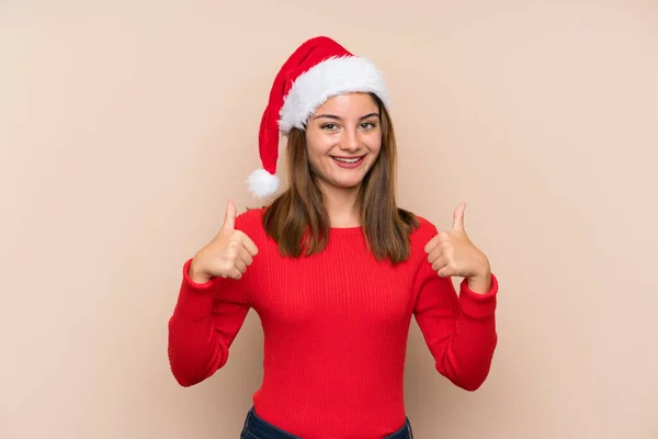 Jeune Fille Avec Chapeau Noël Sur Fond Isolé Donnant Pouce — Photo