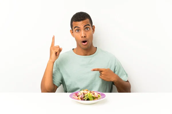 Young Handsome Man Salad Table Surprise Facial Expression — Stock Photo, Image