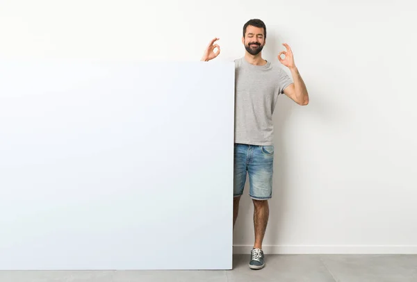 Young Handsome Man Beard Holding Big Blue Empty Placard Zen — Stock Photo, Image