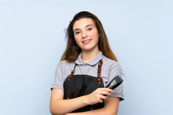 Junge Brünette Mädchen Über Isolierten Blauen Hintergrund Mit Friseur Oder — Stockfoto