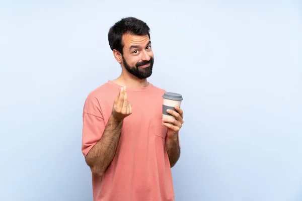 Junger Mann Mit Bart Hält Einen Kaffee Zum Mitnehmen Über — Stockfoto