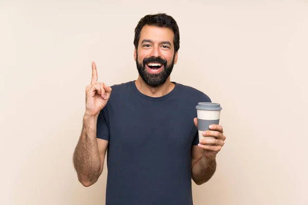 Muž Vousy Drží Kávu Ukazuje Nahoru Skvělý Nápad — Stock fotografie