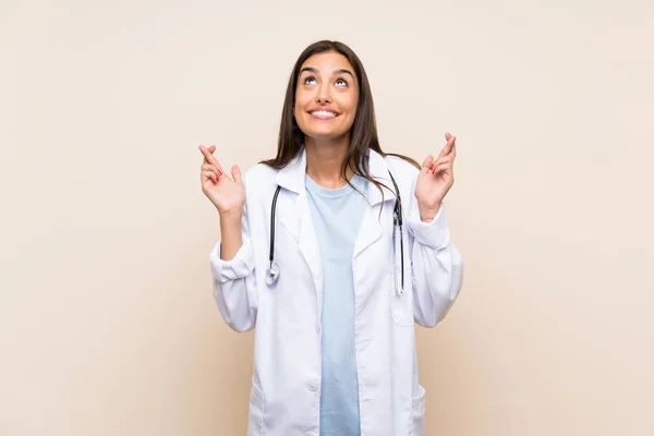 Young Doctor Woman Isolated Background Fingers Crossing — Stock Photo, Image