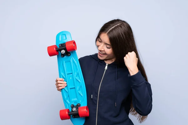 Young Woman Isolated Blue Background Skate Making Victory Gesture — 图库照片