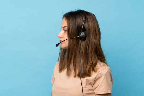Young Brunette Girl Isolated Blue Background Working Headset — Stock Photo, Image