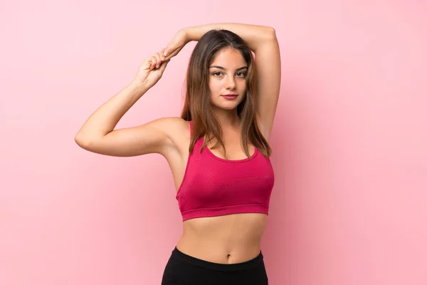 Giovane Ragazza Sportiva Isolato Sfondo Rosa Stretching — Foto Stock