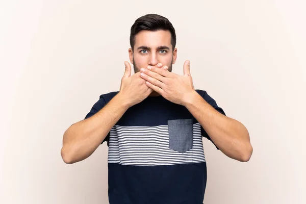 Joven Hombre Guapo Con Barba Sobre Fondo Aislado Cubriendo Boca —  Fotos de Stock