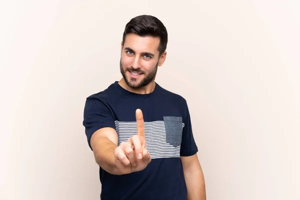 Joven Hombre Guapo Con Barba Sobre Fondo Aislado Mostrando Levantando —  Fotos de Stock