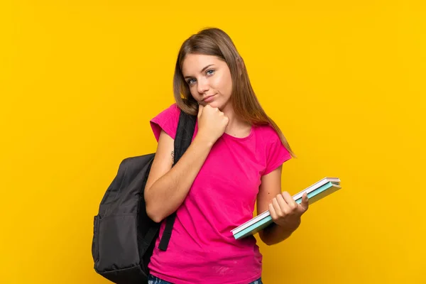 Jovem Estudante Menina Sobre Isolado Fundo Amarelo Com Expressão Triste — Fotografia de Stock