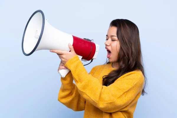 Young Colombian Girl Sweater Isolated Blue Background Shouting Megaphone — Stock Photo, Image