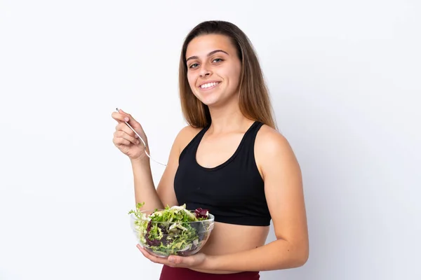 Ragazza adolescente con insalata su sfondo isolato — Foto Stock