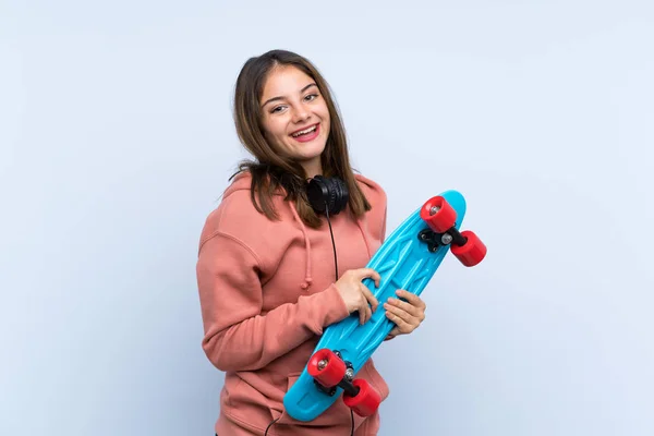 Young skater girl over isolated background — Stock Photo, Image