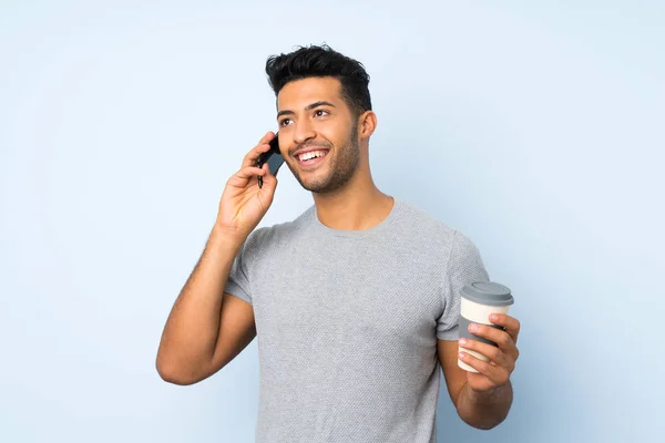 Young Handsome Man Isolated Background Holding Coffee Take Away Mobile — Stock Photo, Image