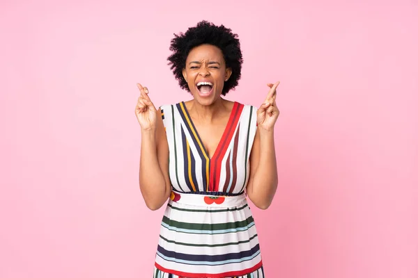 African American Woman Isolated Pink Background Fingers Crossing — 스톡 사진