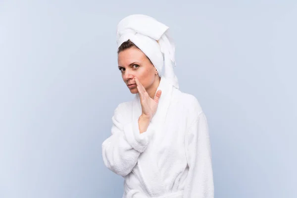 Woman Bathrobe Isolated Blue Background Whispering Something — Stock Photo, Image