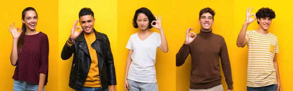 Набір Людей Над Ізольованим Жовтим Тлом Показує Знак Пальцями — стокове фото