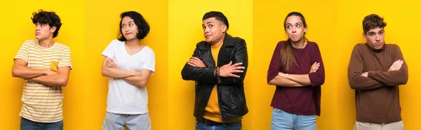 Set of people over isolated yellow background making doubts gesture while lifting the shoulders