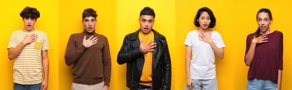 Set of people over isolated yellow background surprised and shocked while looking right