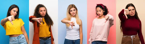 Conjunto Mujeres Sobre Fondo Colorido Aislado Que Muestra Pulgar Hacia — Foto de Stock