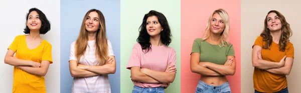 Uppsättning Kvinnor Över Isolerade Färgglada Bakgrund Tittar Upp Medan Leende — Stockfoto