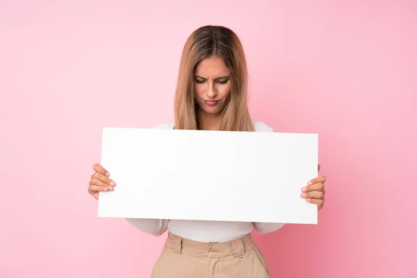Young Blonde Woman Isolated Pink Background Holding Empty White Placard — 图库照片