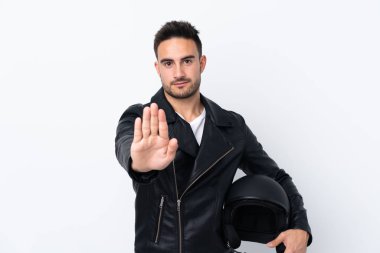 Man with a motorcycle helmet making stop gesture