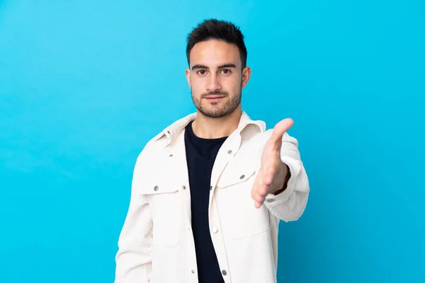 Young Handsome Man Isolated Blue Background Handshaking Good Deal — Stockfoto