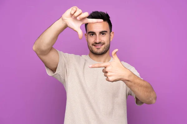 Young Handsome Man Isolated Purple Background Focusing Face Framing Symbol — 스톡 사진