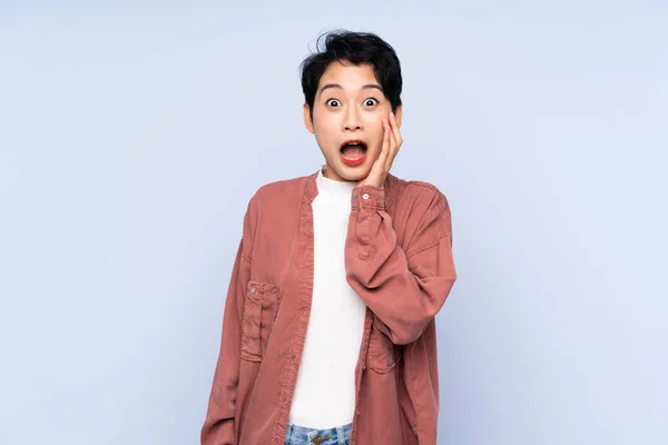 Young Asian Girl Isolated Blue Background Surprise Shocked Facial Expression — 스톡 사진