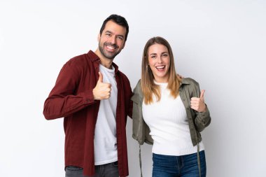 Sevgililer Günü 'nde bir çift, izole edilmiş bir arkaplanda baş parmak işareti yapıyor.