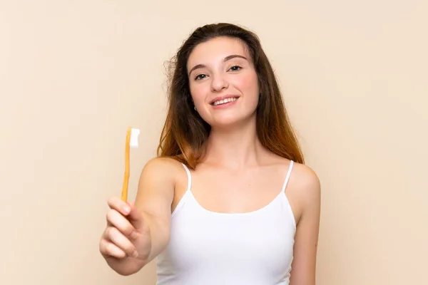 Young brunette girl brushing her teet — Stock Photo, Image
