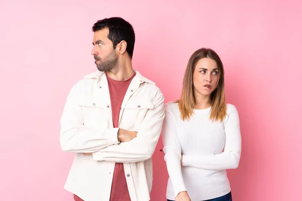 Couple Valentine Day Isolated Pink Background Confuse Face Expression While — 스톡 사진