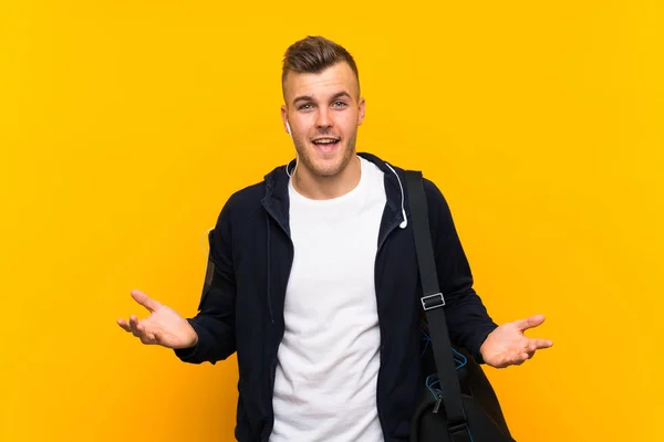 Young Blonde Sport Man Isolated Yellow Background Shocked Facial Expression — Stock Photo, Image