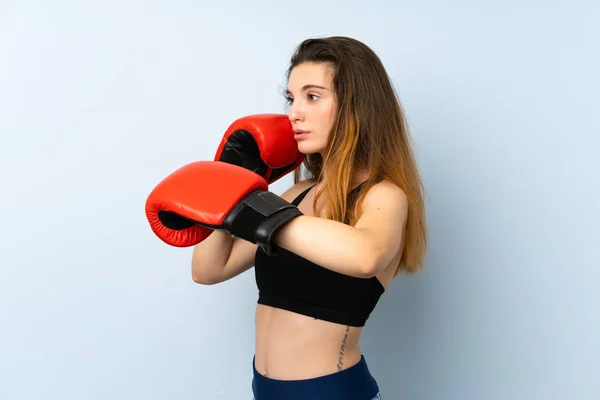 Young brunette girl with boxing gloves over isolated background — Stock Photo, Image