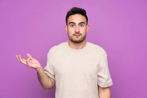 Young Handsome Man Isolated Purple Background Making Doubts Gesture — 스톡 사진