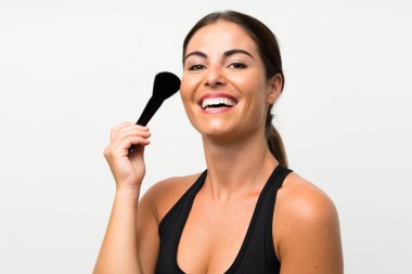 Makyaj fırçasıyla izole edilmiş beyaz arka plan