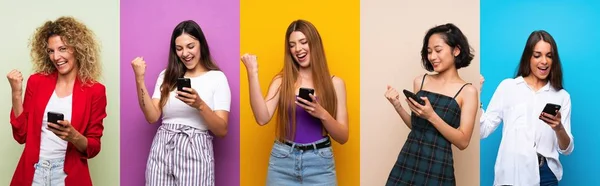 Uppsättning Kvinnor Över Isolerade Färgglada Bakgrund Med Telefon Seger Position — Stockfoto