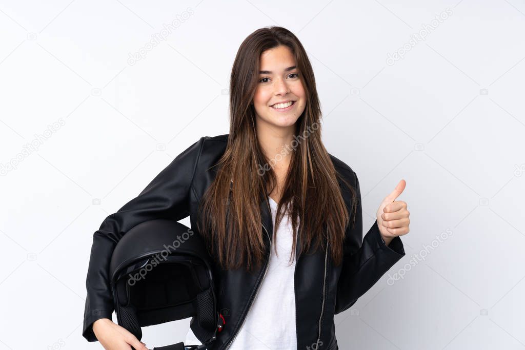 Young woman with a motorcycle helmet over isolated white background giving a thumbs up gesture