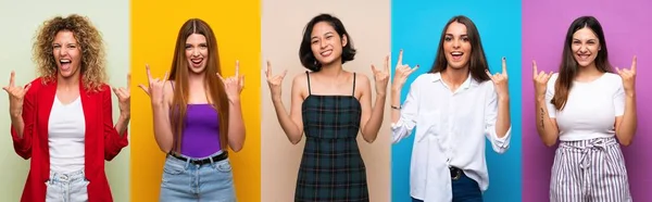 Gruppe Von Frauen Über Isolierten Bunten Hintergrund Machen Rock Geste — Stockfoto
