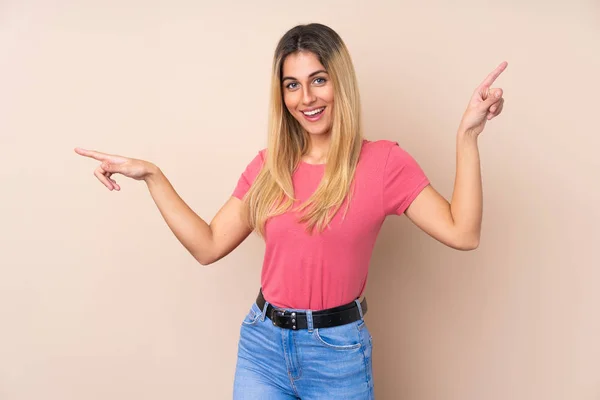 Young Uruguayan Woman Isolated Background Pointing Finger Laterals Happy — 스톡 사진