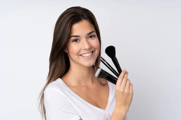 Tonåring Flicka Över Isolerad Bakgrund Hålla Makeup Borste — Stockfoto