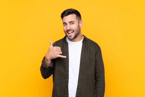 Man Isolated Yellow Background Making Phone Gesture — 스톡 사진