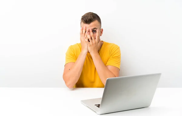 Young Blonde Man Table Laptop Covering Eyes Looking Fingers — Stock Photo, Image
