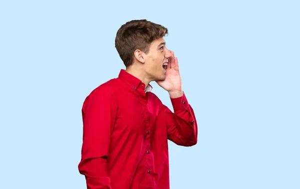 Handsome Young Man Shouting Mouth Wide Open Isolated Blue Background — 스톡 사진