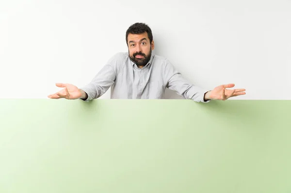 Young Handsome Man Beard Holding Big Green Empty Placard Unhappy — ストック写真