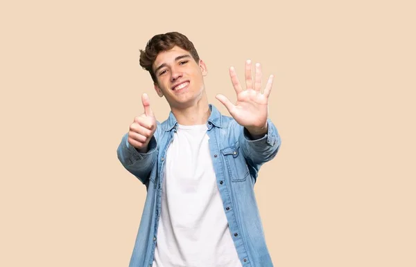 Handsome Young Man Counting Six Fingers Isolated Background — Stock Photo, Image