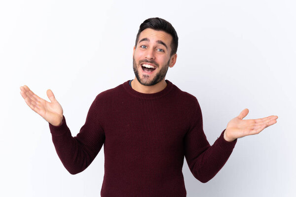 Young handsome man with beard over isolated white background smiling a lot