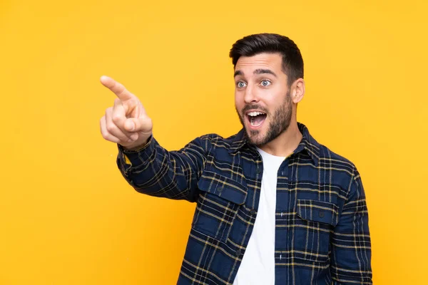 Young Handsome Man Beard Isolated Yellow Background Pointing Away — 스톡 사진