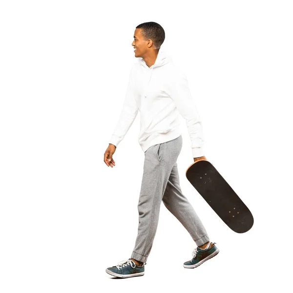 Full-length shot of Afro American skater man over isolated white — Stock Photo, Image
