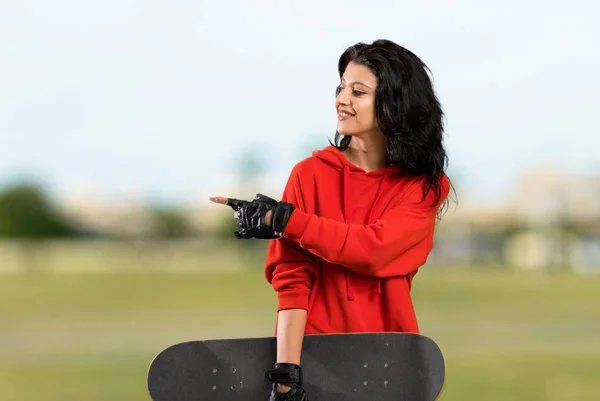 Young Skater Woman Pointing Side Present Product Outdoors — Stock Photo, Image